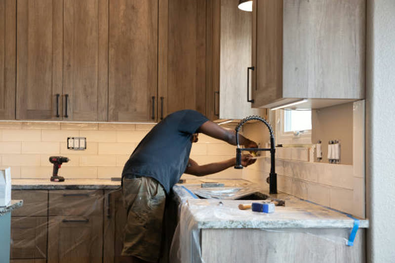 Kitchen plumbing connected behind a fitted unit